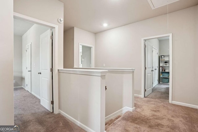 106 Logan Pass Dr, Loganville, GA 30052 - hall with attic access, an upstairs landing, carpet, and baseboards