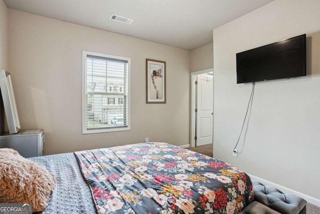 106 Logan Pass Dr, Loganville, GA 30052 - carpeted bedroom featuring baseboards