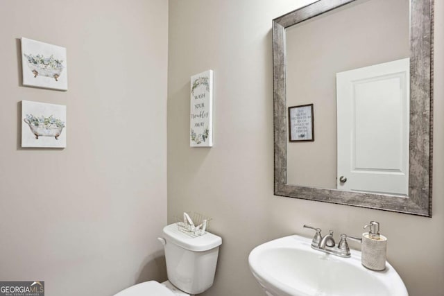 106 Logan Pass Dr, Loganville, GA 30052 - bathroom featuring a sink and toilet