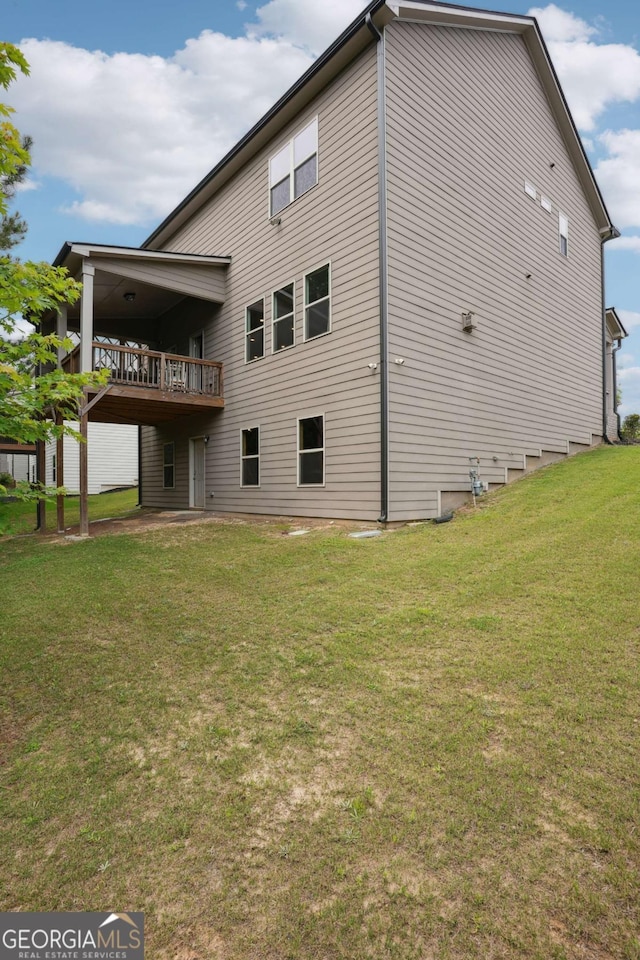106 Logan Pass Dr, Loganville, GA 30052 - back of property featuring a yard and a deck
