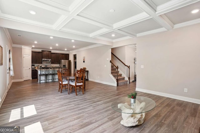 106 Logan Pass Dr, Loganville, GA 30052 - living area featuring stairway, light wood-style floors, recessed lighting, coffered ceiling, and beam ceiling