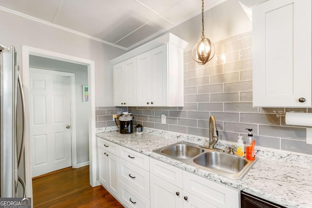 632 Lawson St, Bremen, GA 30110 - kitchen featuring a sink, freestanding refrigerator, white cabinetry, tasteful backsplash, and dark wood-style floors