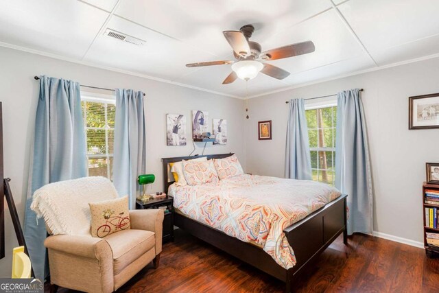 632 Lawson St, Bremen, GA 30110 - bedroom with multiple windows, wood finished floors, crown molding, baseboards, and a ceiling fan