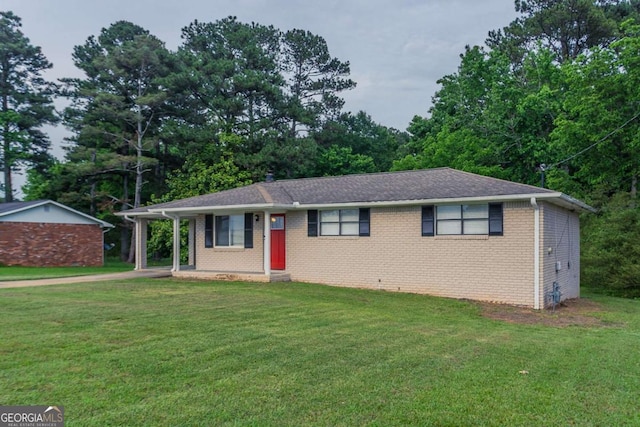 2290 Pope Rd, Douglasville, GA 30135 - ranch-style home featuring a front lawn, driveway, brick siding, and view of scattered trees