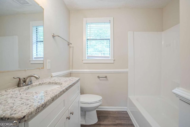 2290 Pope Rd, Douglasville, GA 30135 - full bath with vanity, wood finished floors, and shower / bath combination