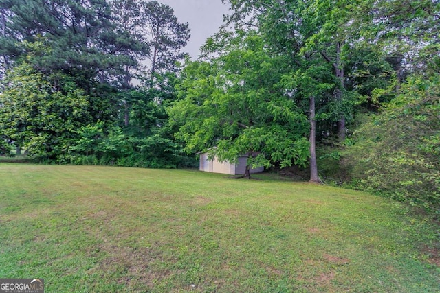 2290 Pope Rd, Douglasville, GA 30135 - view of grassy yard with a storage shed