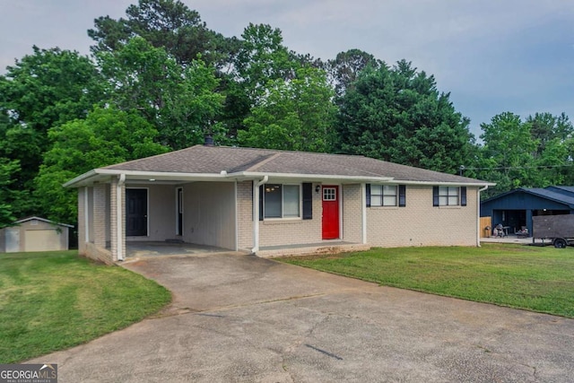 2290 Pope Rd, Douglasville, GA 30135 - single story home featuring driveway, a front yard, an outdoor structure, and an attached carport
