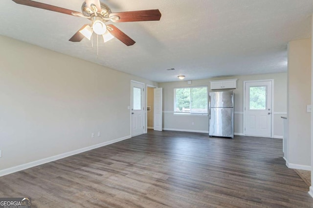 2290 Pope Rd, Douglasville, GA 30135 - unfurnished living room with dark wood finished floors, a ceiling fan, and a textured ceiling