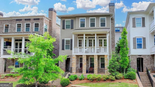 221 Thompson St, Alpharetta, GA 30009 - view of front of house featuring stairs, a balcony, and a chimney