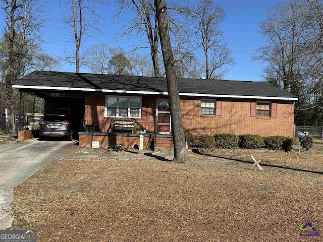 204 Doyle St, Warner Robins, GA 31093 - ranch-style house featuring brick siding, driveway, and an attached carport