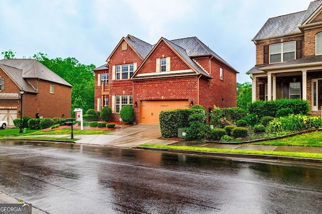 3623 Terrah Point Dr, Duluth, GA 30097 - view of front of home with brick siding, a garage, and driveway
