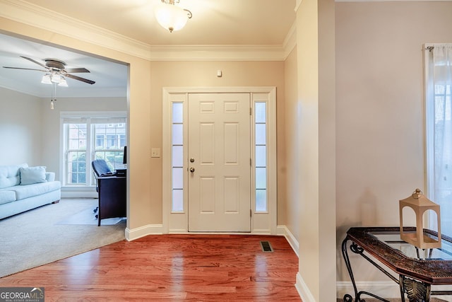 3623 Terrah Point Dr, Duluth, GA 30097 - foyer entrance with wood finished floors, ornamental molding, baseboards, and ceiling fan