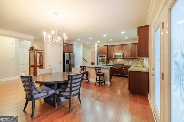3623 Terrah Point Dr, Duluth, GA 30097 - dining space with crown molding, a chandelier, hardwood / wood-style flooring, baseboards, and recessed lighting