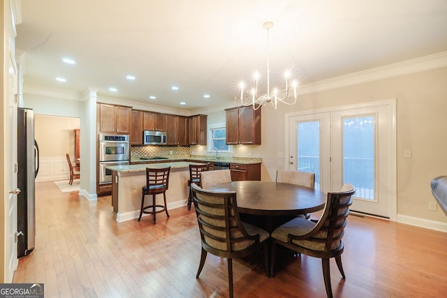 3623 Terrah Point Dr, Duluth, GA 30097 - dining area featuring crown molding, a chandelier, wood finished floors, and recessed lighting