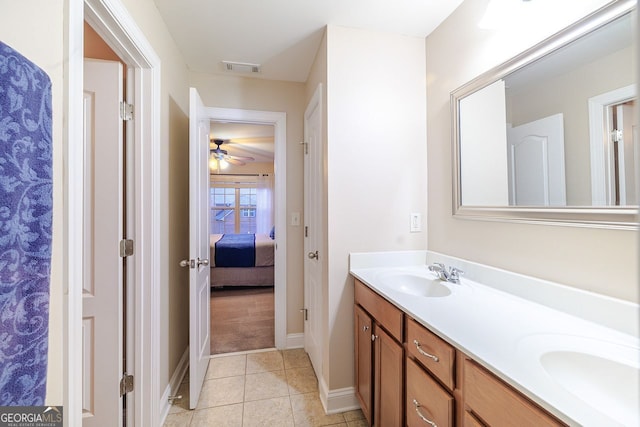 3623 Terrah Point Dr, Duluth, GA 30097 - ensuite bathroom featuring double vanity, tile patterned flooring, baseboards, and a ceiling fan