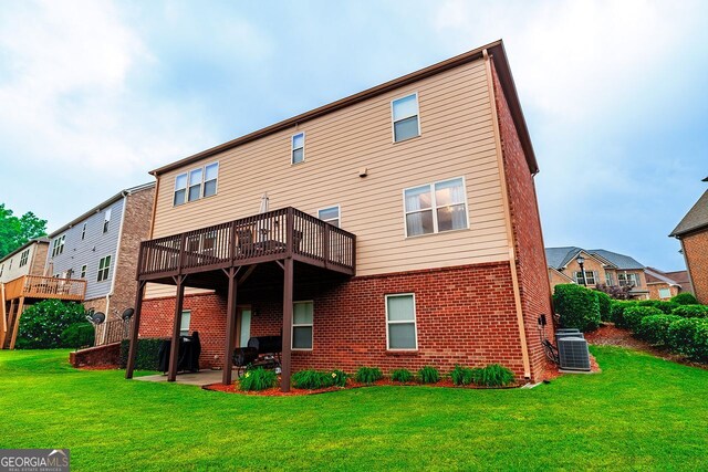 3623 Terrah Point Dr, Duluth, GA 30097 - rear view of property featuring central air condition unit, brick siding, a lawn, a patio area, and a deck