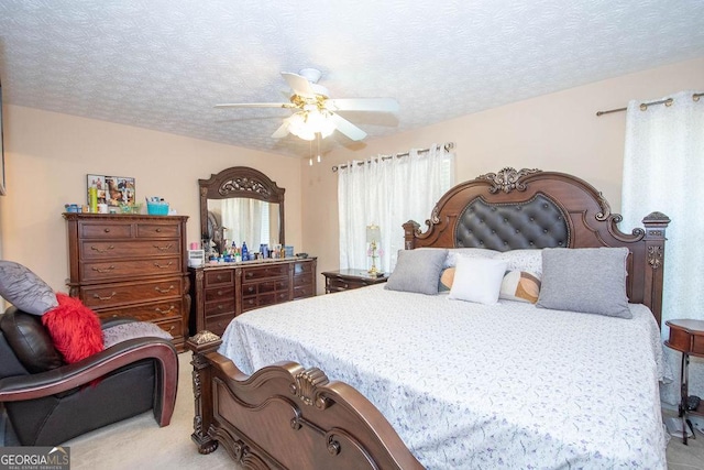 1346 Revelstoke Cv, Riverdale, GA 30296 - bedroom with light colored carpet, a textured ceiling, and a ceiling fan