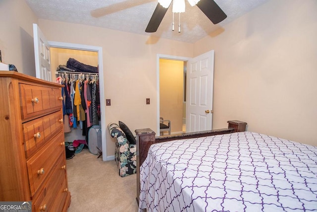1346 Revelstoke Cv, Riverdale, GA 30296 - bedroom with light carpet, a closet, a spacious closet, ceiling fan, and baseboards