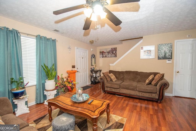 1346 Revelstoke Cv, Riverdale, GA 30296 - living area with a textured ceiling, ceiling fan, wood finished floors, and baseboards