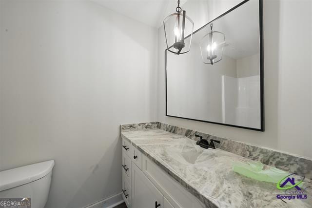 116 Fred Ct, Macon, GA 31216 - bathroom featuring vanity, toilet, and baseboards