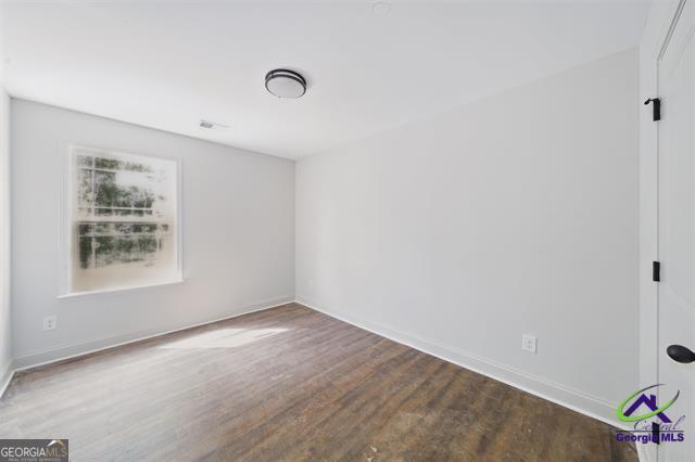 116 Fred Ct, Macon, GA 31216 - empty room featuring wood finished floors and baseboards