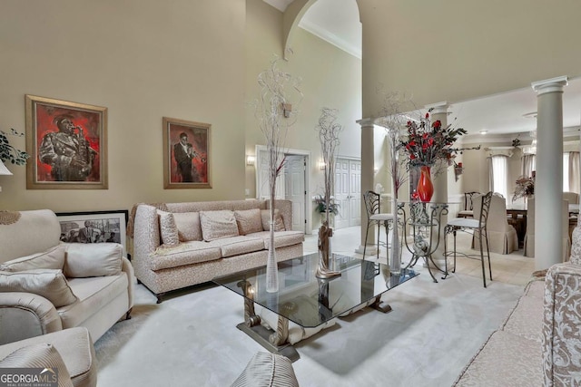 226 Long Island Dr, Whitesburg, GA 30185 - carpeted living room with a high ceiling, ornate columns, and arched walkways
