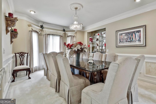 226 Long Island Dr, Whitesburg, GA 30185 - dining area with a chandelier, light colored carpet, ornamental molding, a wainscoted wall, and a decorative wall