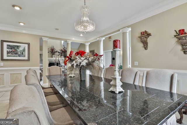 226 Long Island Dr, Whitesburg, GA 30185 - dining space with ornate columns, ornamental molding, a chandelier, and wainscoting