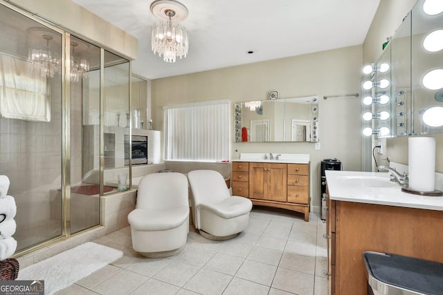 226 Long Island Dr, Whitesburg, GA 30185 - bathroom with tile patterned floors, a shower stall, a chandelier, vanity, and healthy amount of natural light