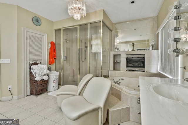 226 Long Island Dr, Whitesburg, GA 30185 - bathroom with a jetted tub, tile patterned floors, a stall shower, vanity, and a chandelier