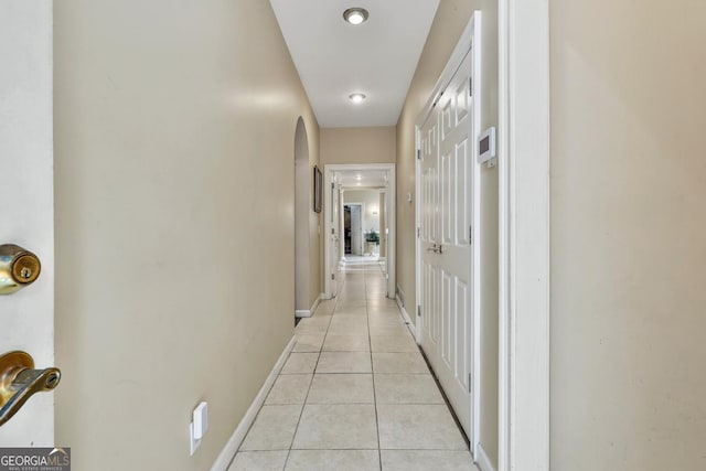 226 Long Island Dr, Whitesburg, GA 30185 - hallway featuring light tile patterned floors and arched walkways