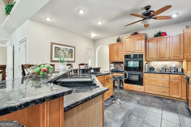 226 Long Island Dr, Whitesburg, GA 30185 - kitchen featuring ceiling fan, arched walkways, decorative backsplash, gas stovetop, and recessed lighting