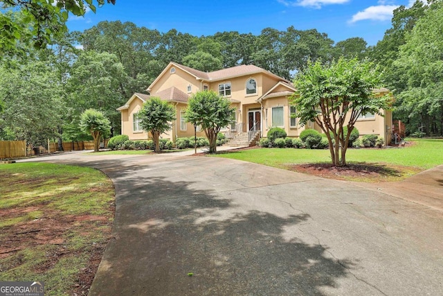 226 Long Island Dr, Whitesburg, GA 30185 - view of front of house featuring stucco siding and concrete driveway