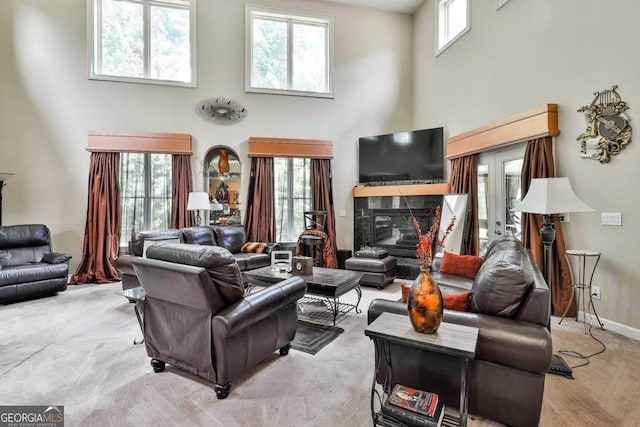 226 Long Island Dr, Whitesburg, GA 30185 - carpeted living room featuring a towering ceiling and a high end fireplace