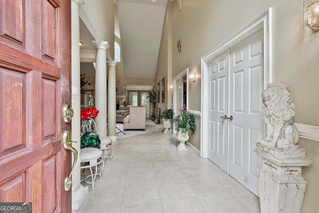 226 Long Island Dr, Whitesburg, GA 30185 - entryway with high vaulted ceiling, ornate columns, and light tile patterned floors