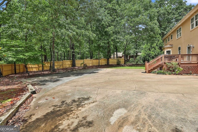 226 Long Island Dr, Whitesburg, GA 30185 - view of patio featuring a deck and view of wooded area