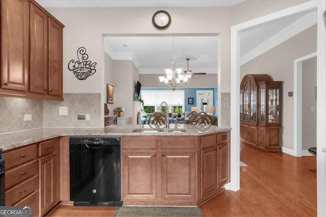 3554 Black Cherry Pt SW, Gainesville, GA 30504 - kitchen featuring black dishwasher, a sink, a chandelier, light wood-style floors, and light stone counters
