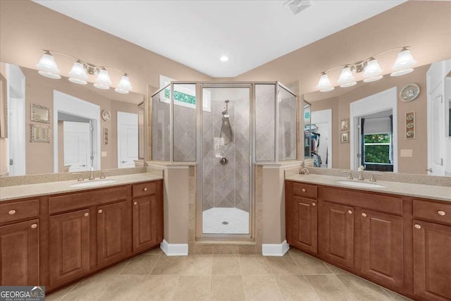 3554 Black Cherry Pt SW, Gainesville, GA 30504 - full bath featuring a shower stall, two vanities, and tile patterned floors