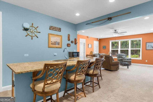 3554 Black Cherry Pt SW, Gainesville, GA 30504 - dining area featuring recessed lighting, light carpet, baseboards, and a ceiling fan