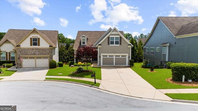 3554 Black Cherry Pt SW, Gainesville, GA 30504 - view of front of home with concrete driveway, stone siding, a front lawn, and an attached garage
