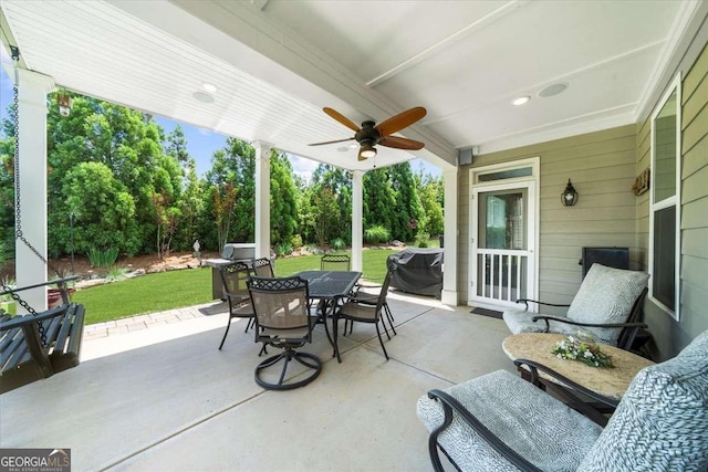 3554 Black Cherry Pt SW, Gainesville, GA 30504 - view of patio / terrace with outdoor dining space, a ceiling fan, a grill, and view of scattered trees
