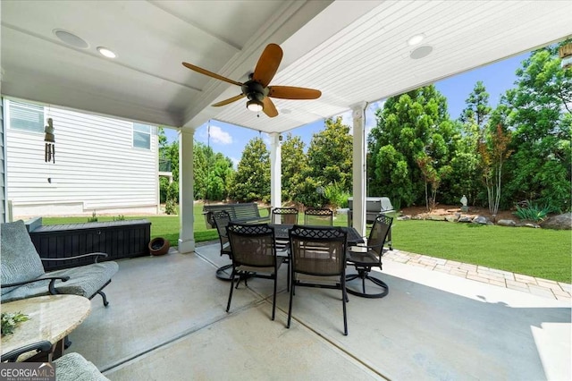 3554 Black Cherry Pt SW, Gainesville, GA 30504 - view of patio / terrace with outdoor dining area, ceiling fan, and view of scattered trees