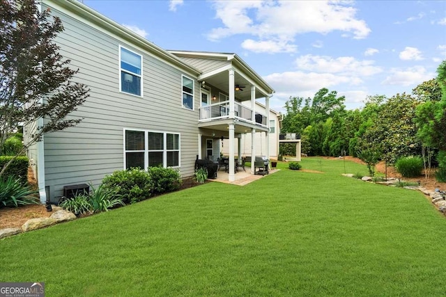 3554 Black Cherry Pt SW, Gainesville, GA 30504 - back of house with a balcony, a patio area, a yard, and a ceiling fan