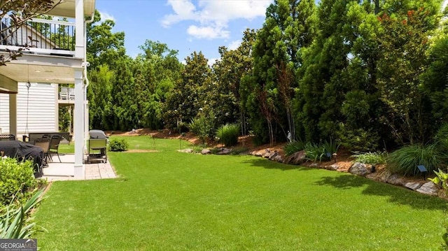 3554 Black Cherry Pt SW, Gainesville, GA 30504 - view of grassy yard featuring a balcony and a patio