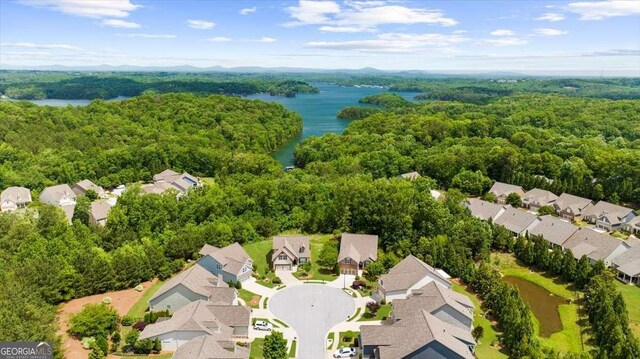 3554 Black Cherry Pt SW, Gainesville, GA 30504 - aerial perspective of suburban area with a large body of water and a heavily wooded area