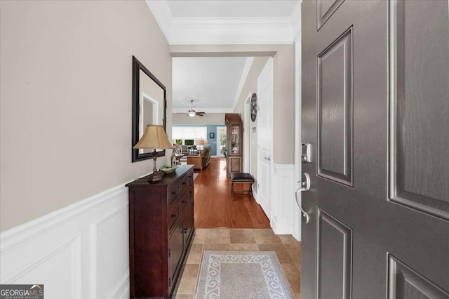 3554 Black Cherry Pt SW, Gainesville, GA 30504 - entryway featuring ornamental molding, a wainscoted wall, a decorative wall, and a ceiling fan