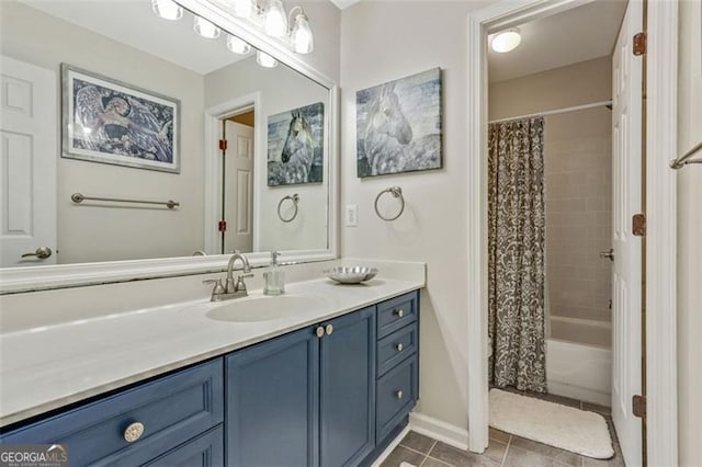 2073 Woodside Park Dr, Woodstock, GA 30188 - full bath with vanity, tile patterned flooring, shower / bathtub combination with curtain, and baseboards