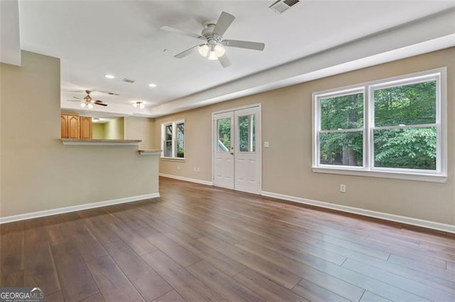 2073 Woodside Park Dr, Woodstock, GA 30188 - unfurnished living room featuring ceiling fan, baseboards, dark wood-type flooring, recessed lighting, and stairway