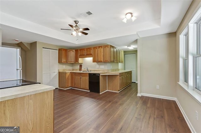 2073 Woodside Park Dr, Woodstock, GA 30188 - kitchen featuring dishwasher, freestanding refrigerator, a tray ceiling, and light countertops