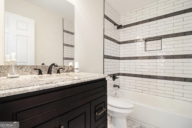 523 Mount Zion, Hapeville, GA 30354 - full bathroom featuring marble look tile flooring, vanity, toilet, and shower / tub combination
